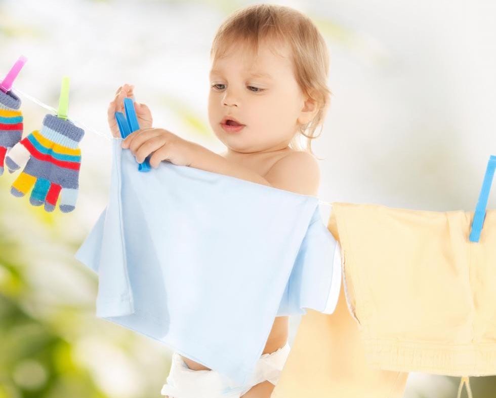 litle boy stretching clothes